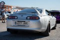 Rear view of a white Toyota Supra sports car