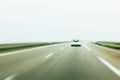 Rear view of white white car driving on German autobahn Royalty Free Stock Photo