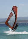 A rear view of a windsurfer