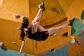 Rear view on woman climbing rock mountain for adventure and sport Royalty Free Stock Photo