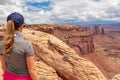 Canoynlands - Rear view of woman in front of Mesa Arch near Moab, Canyonlands National Park, San Juan County, Southern Utah, USA Royalty Free Stock Photo