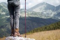 Rear view of woman with hiking stick looking at the mountains Royalty Free Stock Photo