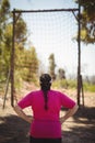 Rear view of woman looking at net during obstacle course Royalty Free Stock Photo