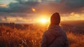 Rear view of a woman looking towards to the future, a hopeful gaze into the sunset