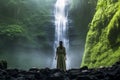 Rear view of a woman looking at tropical waterfall Generative Ai