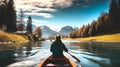 Rear view of woman riding canoe in stream with background of beautiful landscape