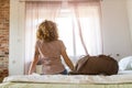 Woman sitting on bed in youth hostel Royalty Free Stock Photo