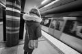 rear view of woman waiting for a subway train in city of Stockholm Sweden Royalty Free Stock Photo