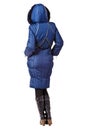 Rear view of woman in winter blue hooded coat