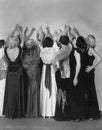 Rear view of women reaching Royalty Free Stock Photo