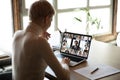 Woman sitting at desk watching new videoconference application online review Royalty Free Stock Photo