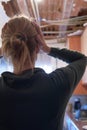 Rear view worried woman because kitchen ceiling has collapsed