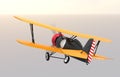 Rear view of yellow and black biplane flying in the sky Royalty Free Stock Photo