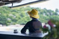 Rear view of young Asian beauty sitting, relaxing at beach bar in vacation Royalty Free Stock Photo