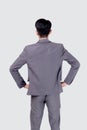 Rear view of young asian businessman in suit with confident isolated on white background. Royalty Free Stock Photo