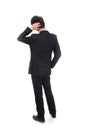 Rear view of young business man confused Royalty Free Stock Photo