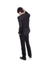 Rear view of young business man confused Royalty Free Stock Photo