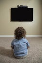 Rear view of a young child watching Television Royalty Free Stock Photo