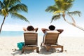 Couple Relaxing On Deck Chair Royalty Free Stock Photo