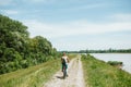 Rear view of young cyclist woman riding a bike Royalty Free Stock Photo