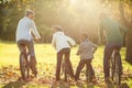 Rear view of a young family doing a bike ride Royalty Free Stock Photo