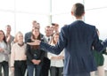 rear view. the young leader explaining something to his team Royalty Free Stock Photo