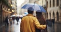 A Rear View of a Young, In-Love Couple Walking in the City Rain