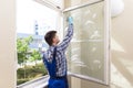 Housekeeper Cleaning Window Royalty Free Stock Photo