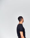 Rear View Of Young Man Looking Away From Camera In Studio Royalty Free Stock Photo