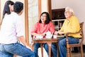 Rear view of young man and woman visiting parents at home