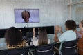 Business colleagues applauding while attending a video call in a conference room Royalty Free Stock Photo