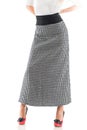 Rear view young slim woman posing in a long skirt Royalty Free Stock Photo