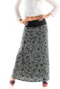 Rear view young slim woman posing in a long skirt Royalty Free Stock Photo