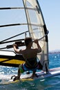 Rear view of young windsurfer Royalty Free Stock Photo