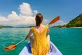 Young woman paddling a canoe during vacation in Flores Island, Indonesia Royalty Free Stock Photo