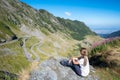 Woman at the famous curvy road in Fagaras mountains Royalty Free Stock Photo