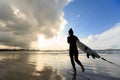 Woman surfer with white surfboard on a beach Royalty Free Stock Photo