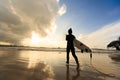 Woman surfer with white surfboard on a beach Royalty Free Stock Photo