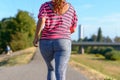 Young woman running along river Royalty Free Stock Photo