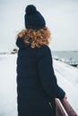 Rear view of young woman wearing warm coat Royalty Free Stock Photo