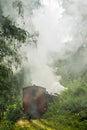Rear of vintage train disappearing in thick smoke.. Royalty Free Stock Photo