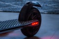 Rear wheel and brake light on an e-scooter