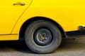 Rear Wheel Details Of An Antique Yellow Car
