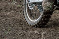 Rear wheel motocross bike on the background of the track Royalty Free Stock Photo