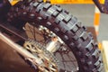 Rear wheel of motorcycle, studded tire and chain Royalty Free Stock Photo