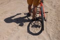 Rear wheel of mountain bike and rider leg Royalty Free Stock Photo