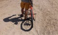 Rear wheel of mountain bike and rider leg Royalty Free Stock Photo