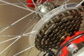 View of the red bicycle wheel, zooming in on the rear derailleur modes Royalty Free Stock Photo