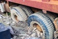 The rear wheels of the three-axis truck got stuck in the mud after the deluge Royalty Free Stock Photo