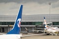 Rear wing of aircraft of Travel Service airlina company at Vaclav Havel Prague Airport and Smartwings airplane in the background